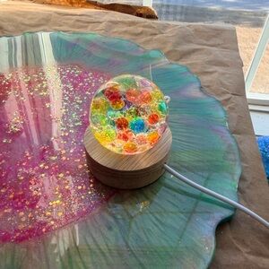 Colorful Glass Orb Light on Wooden Base